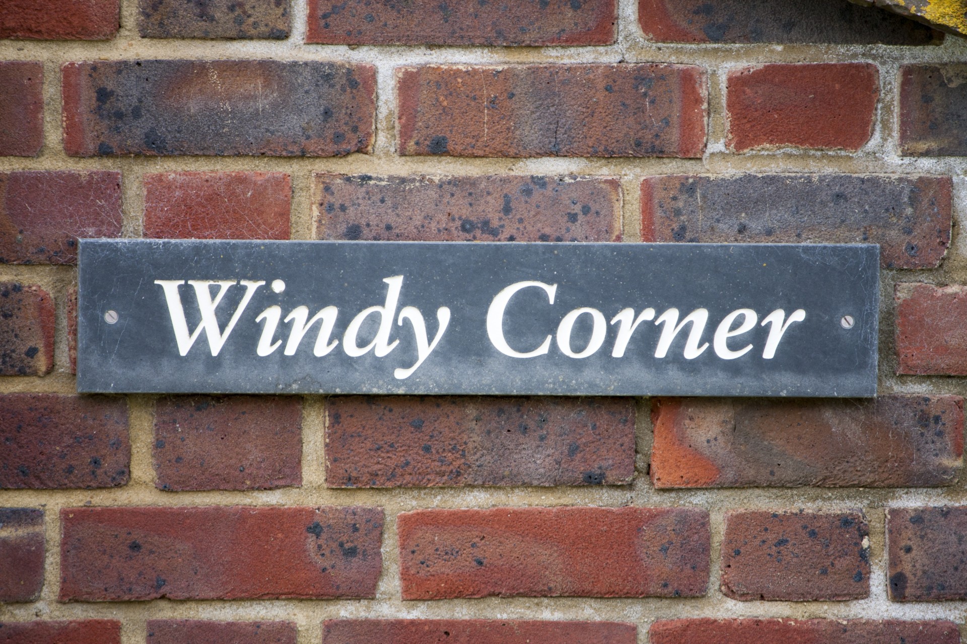 windy corner sign house name free photo