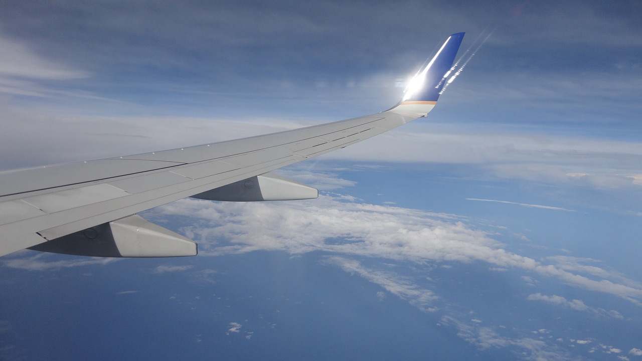 wings aircraft clouds free photo