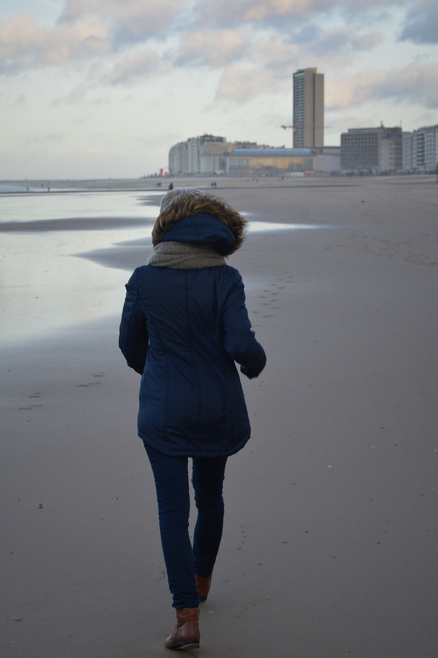 winter winter clothing walk on the beach free photo