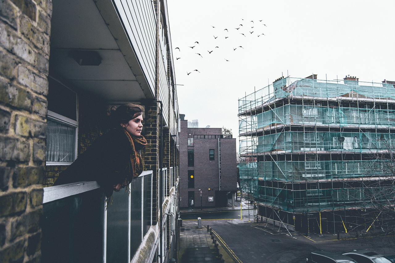 woman balcony city free photo