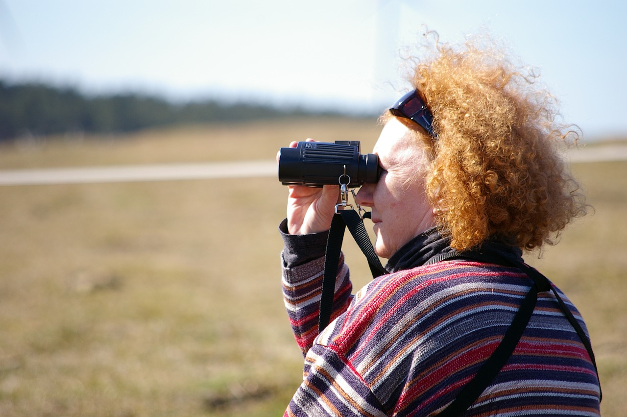 woman redhead binoculars free photo
