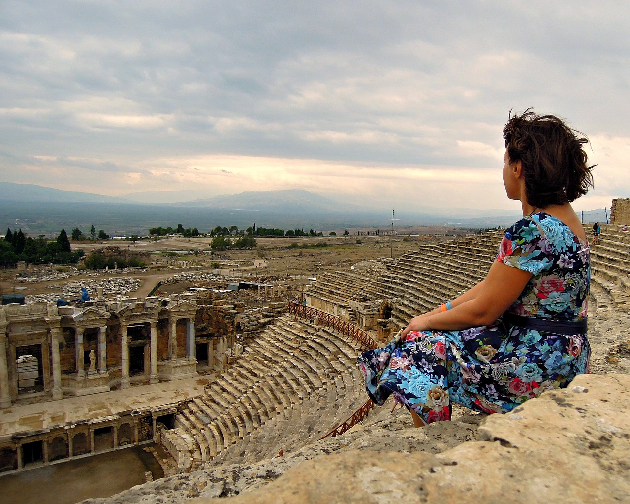 woman sitting amphitheater free photo
