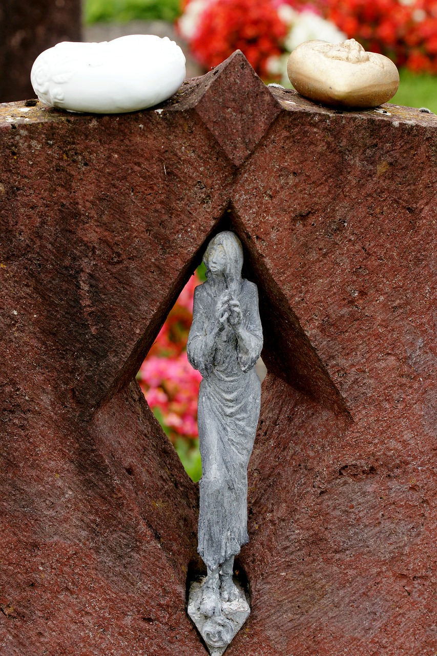 woman praying woman cemetery free photo