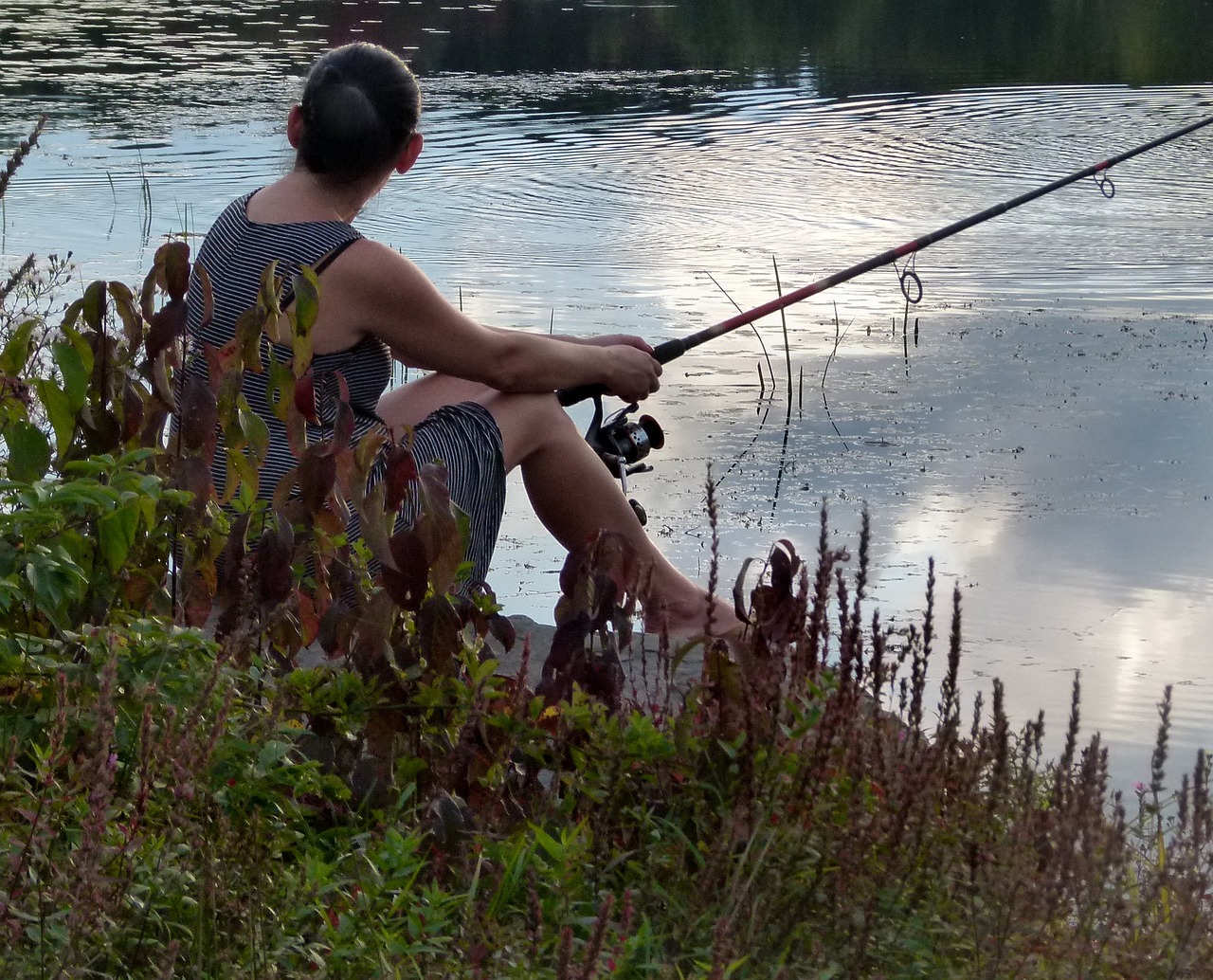 woman fishing lake free photo