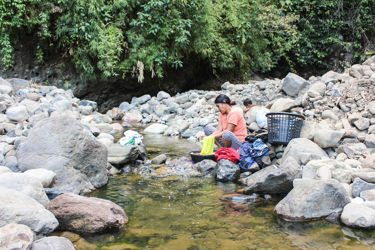 woman  washing  river free photo