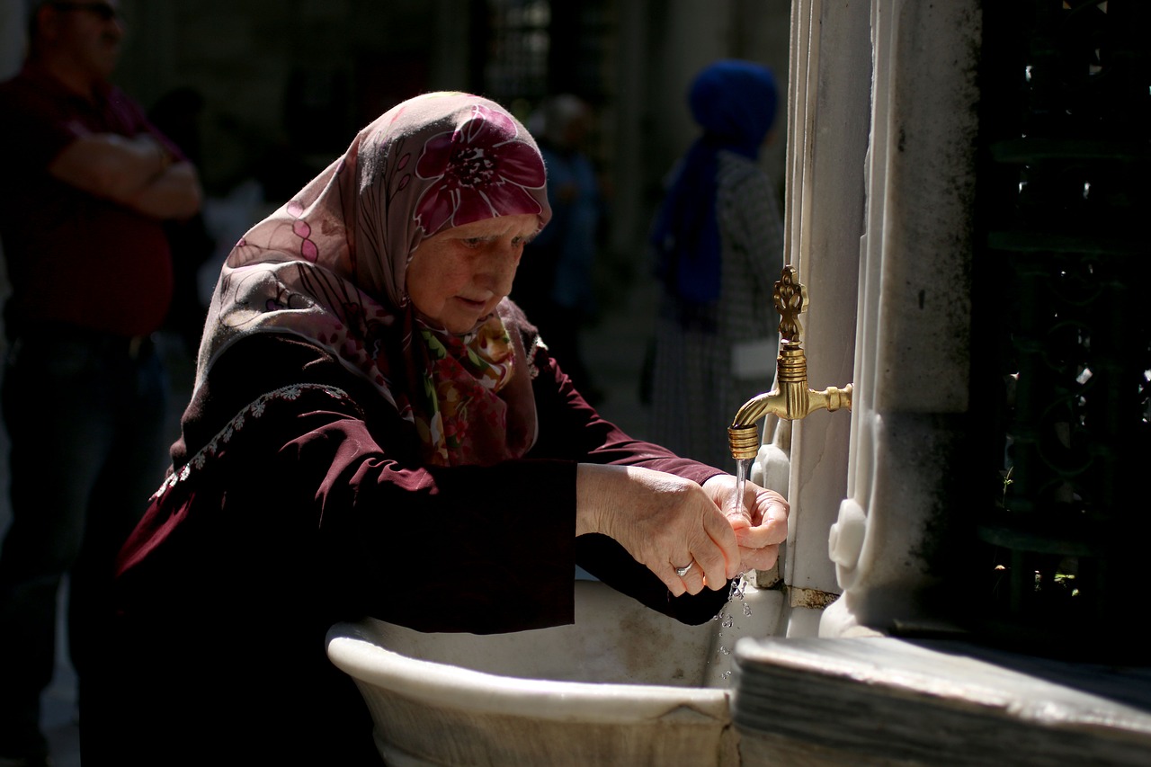 woman  tap  fountain free photo