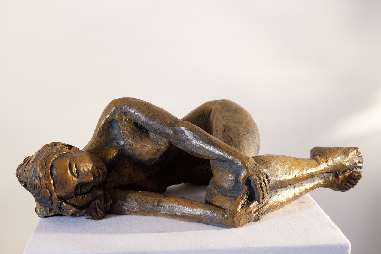 woman lying down sculpture free photo