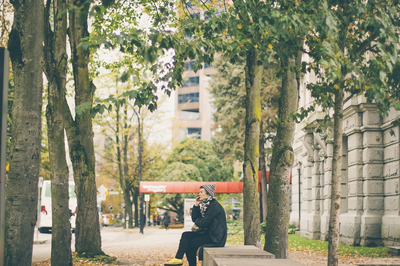 woman talking cell phone free photo