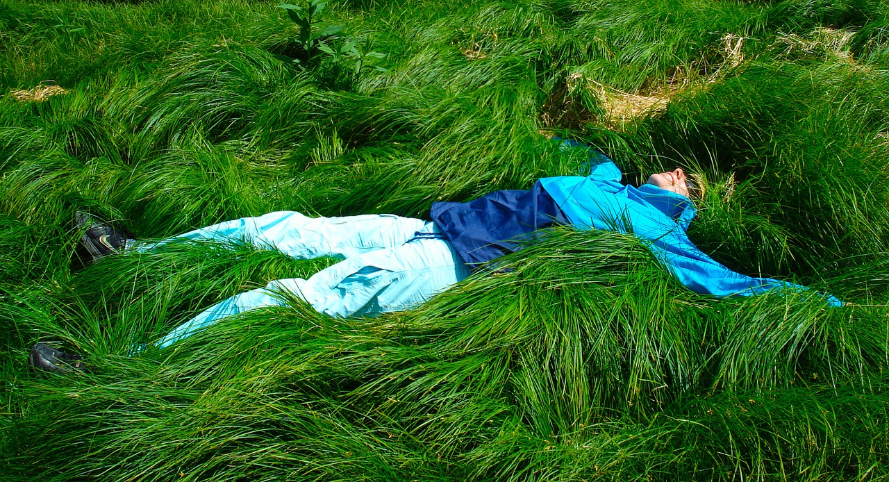 woman lying grass free photo