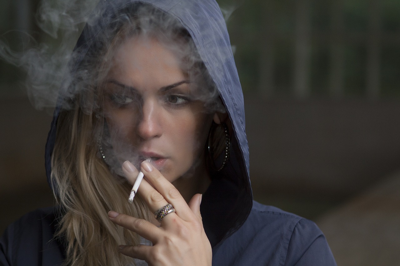 woman smoking cigarette free photo