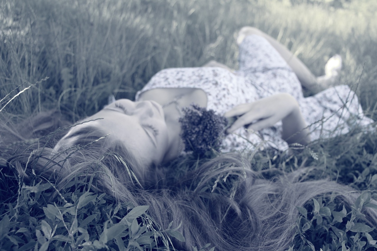 woman sleeping grass free photo