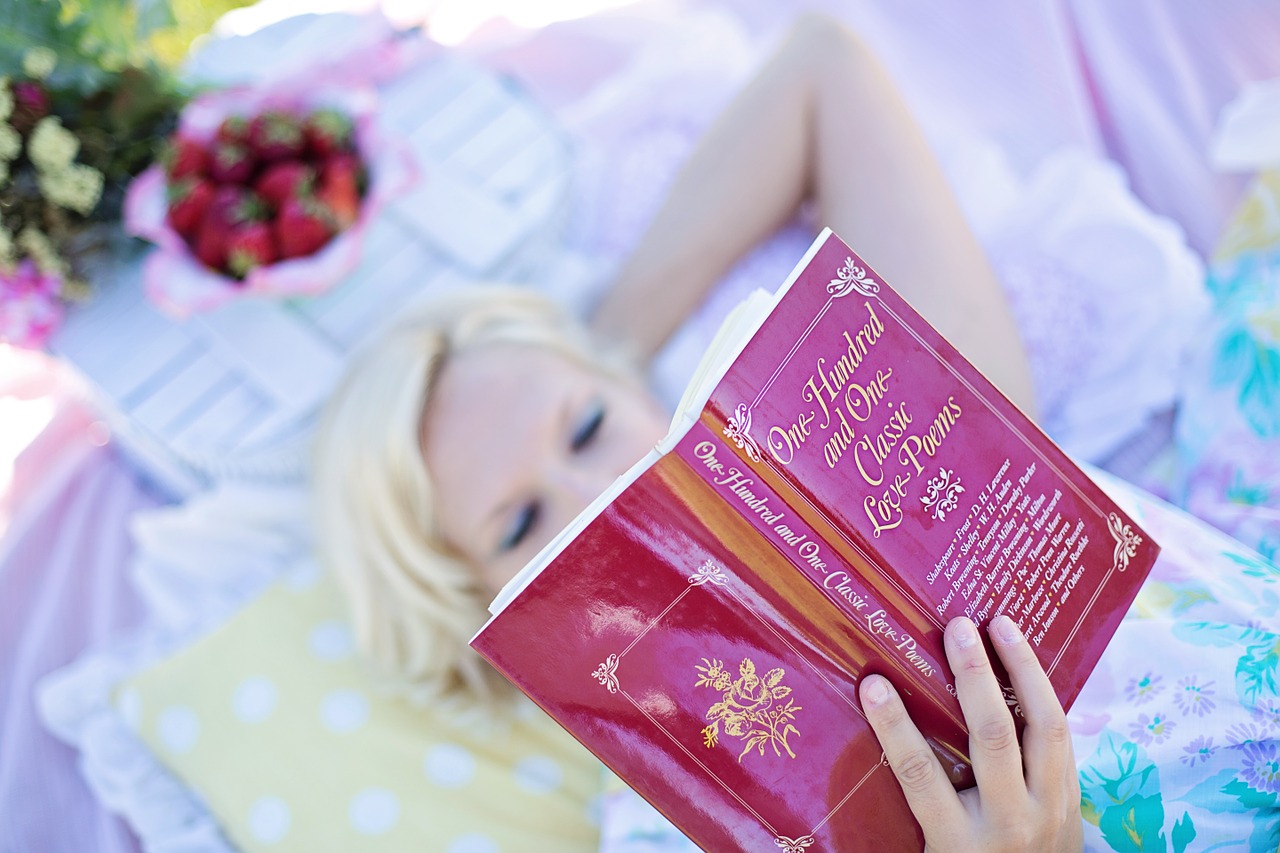 woman reading love poem book picnic free photo