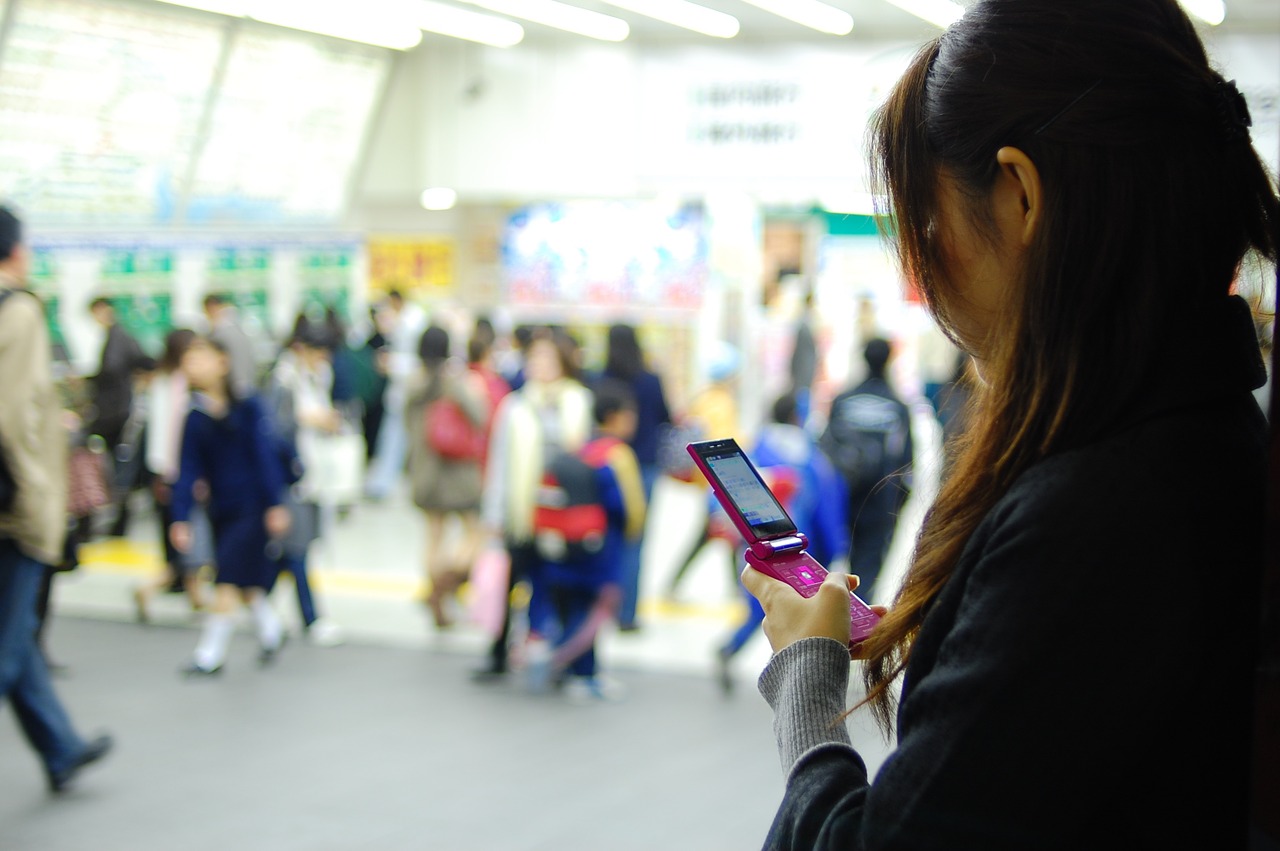 women mobile phone shibuya station free photo