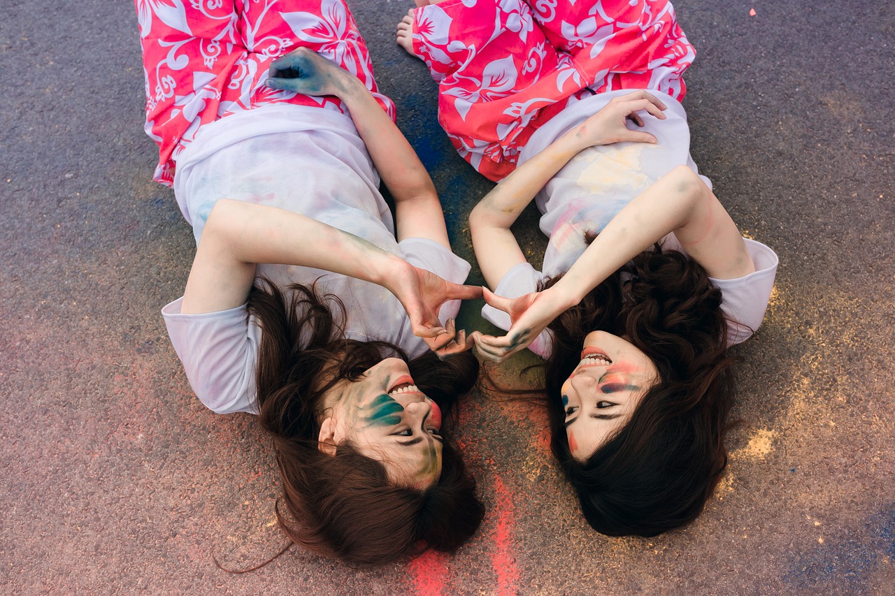 women friendship lying down free photo