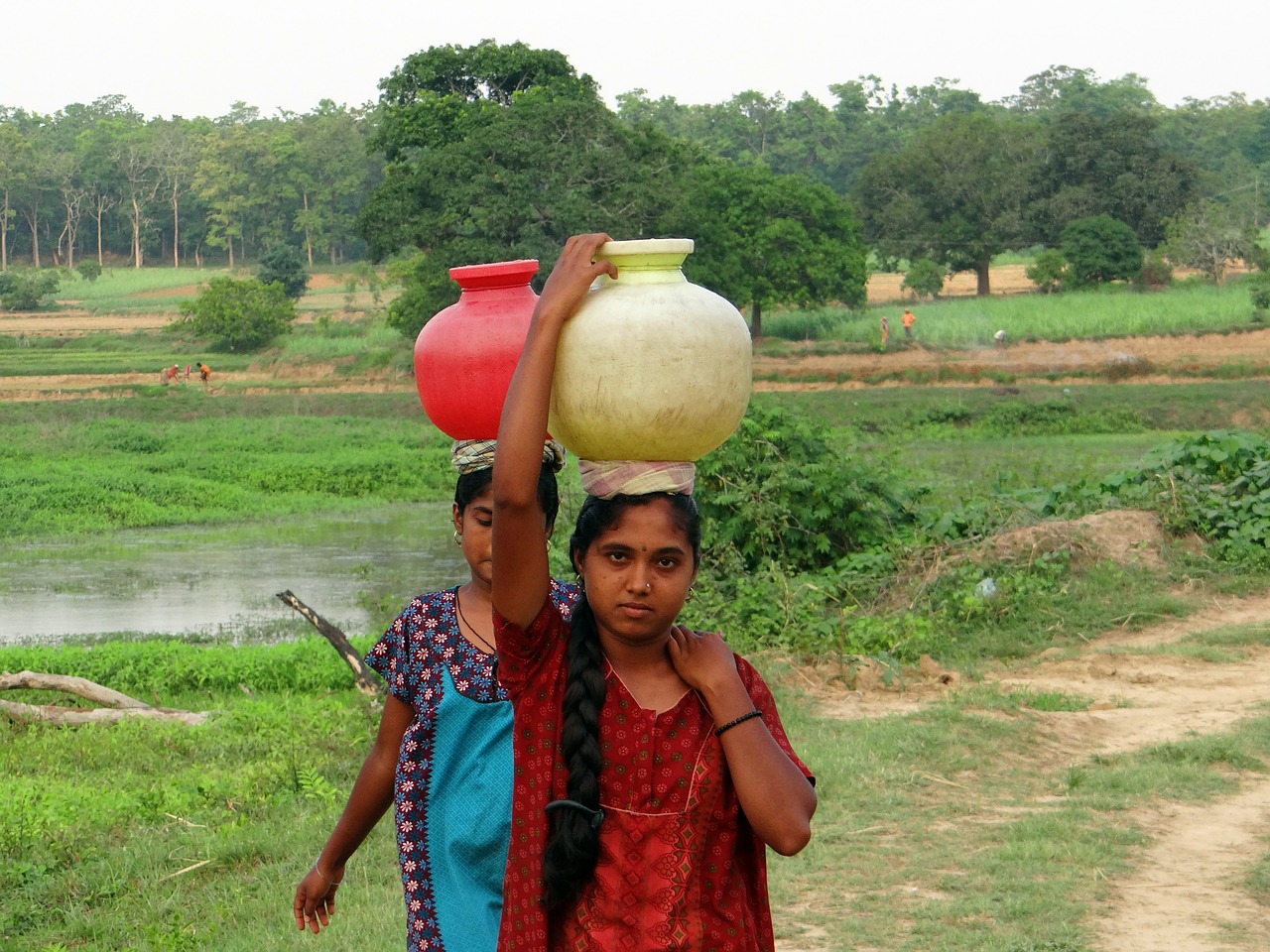 women village fetching water free photo