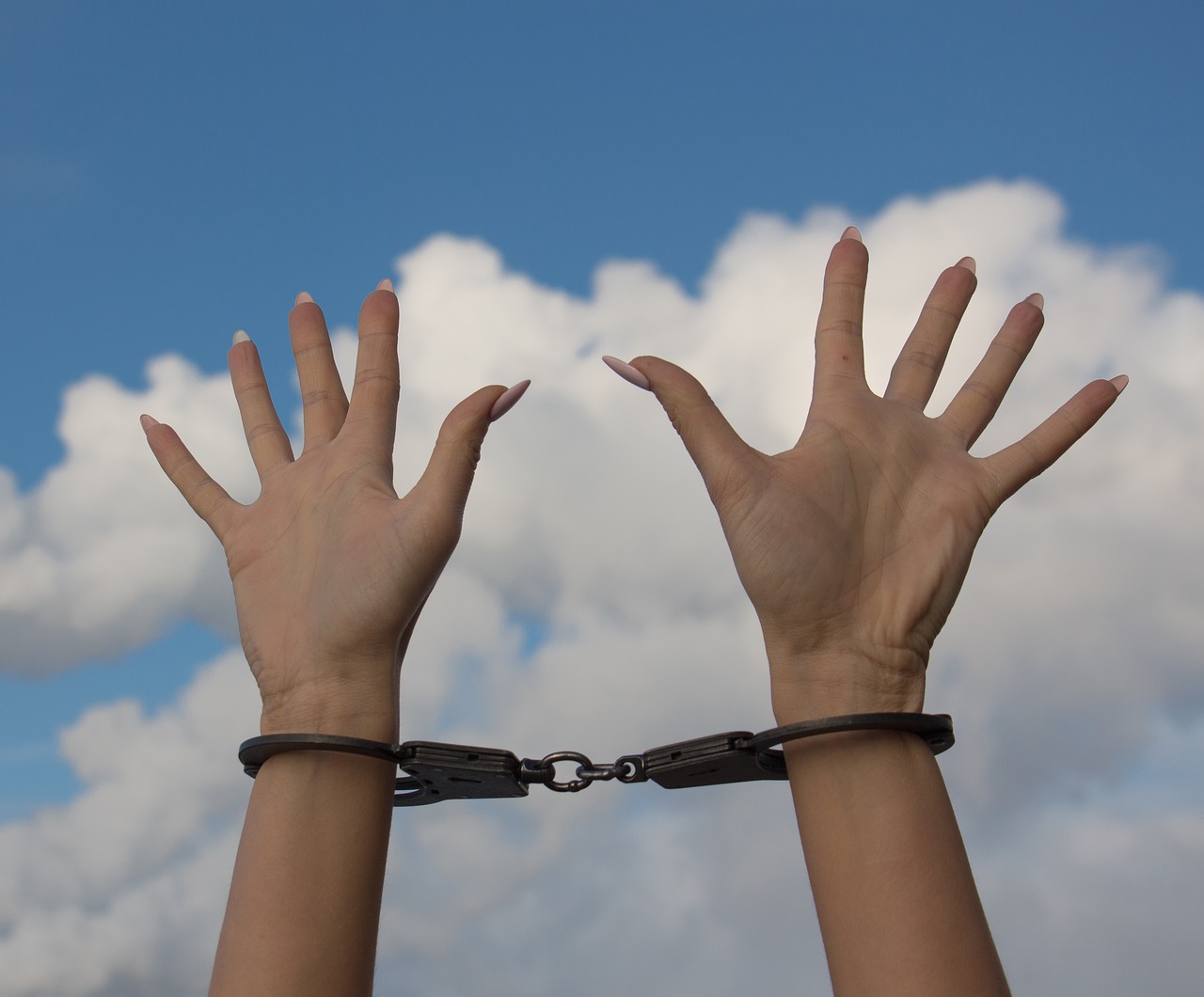 women's hands handcuffs free photo