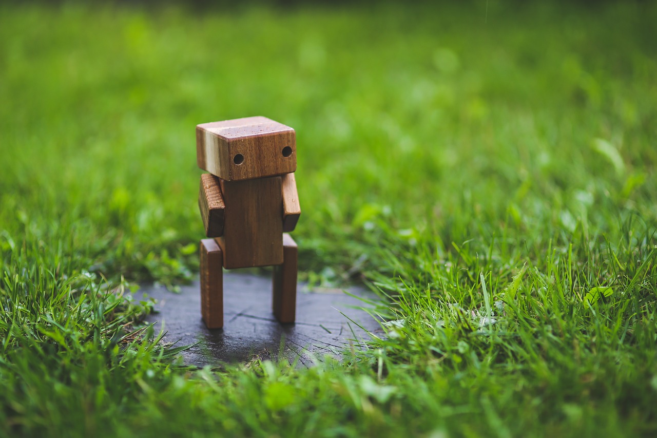 wooden robot grass free photo