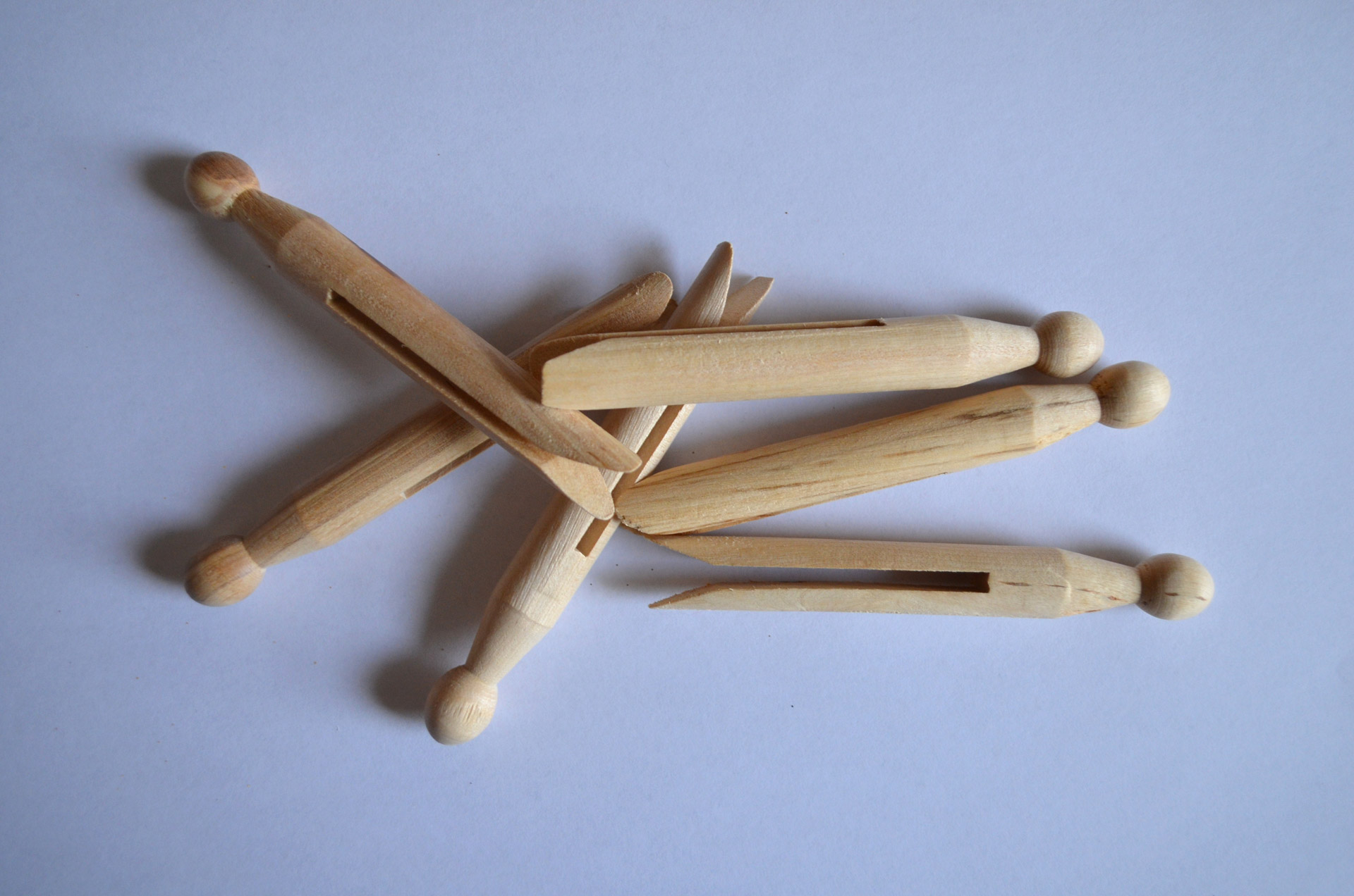wooden clothes-pegs background free photo