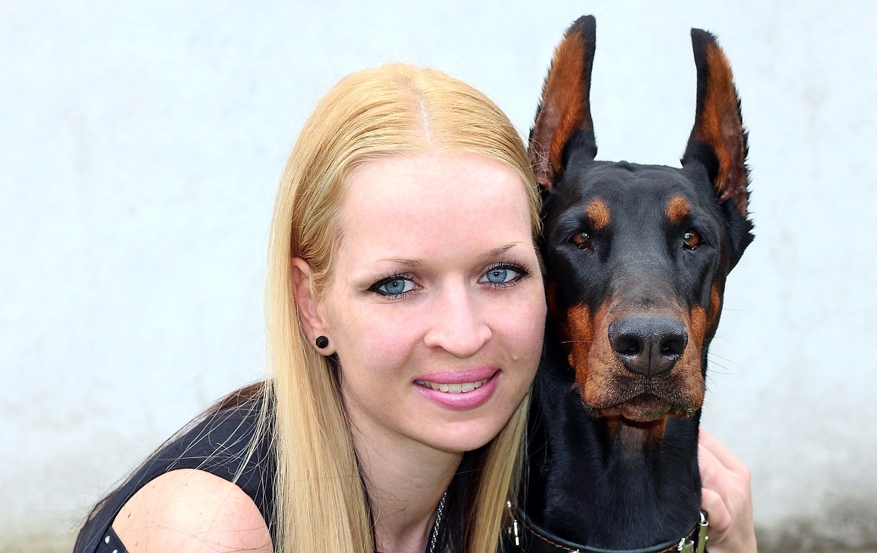 head image woman and dog doberman free photo