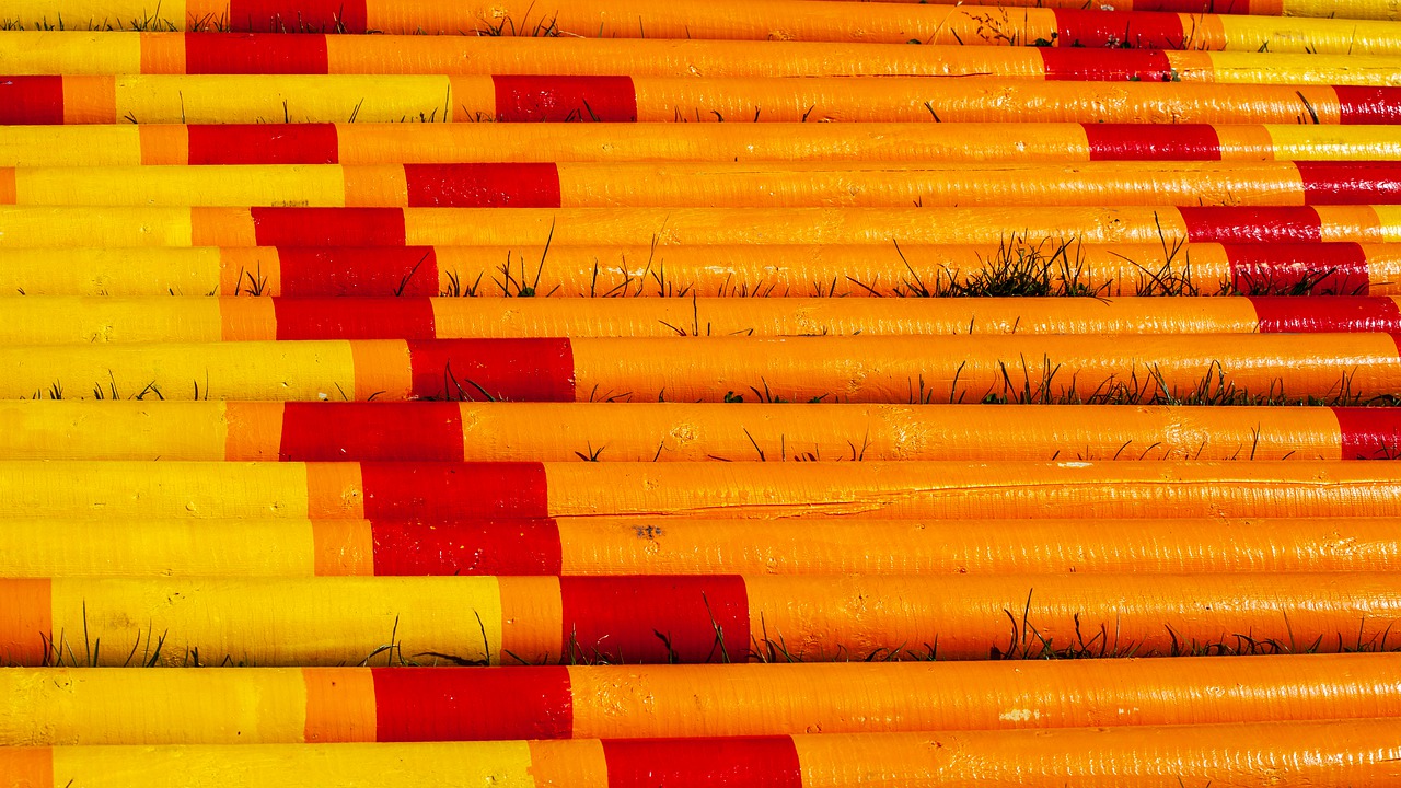 yellow and orange poles  horse jump poles  coloured poles free photo