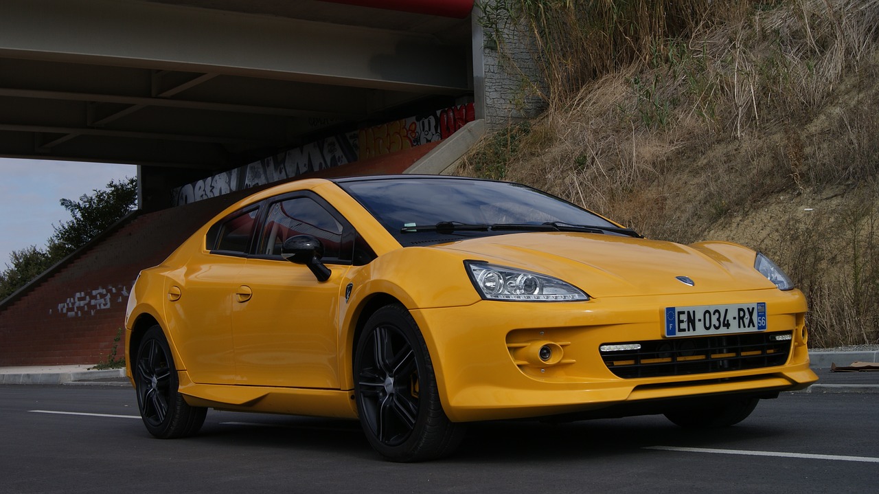 yellow car  motor sport  automobile free photo