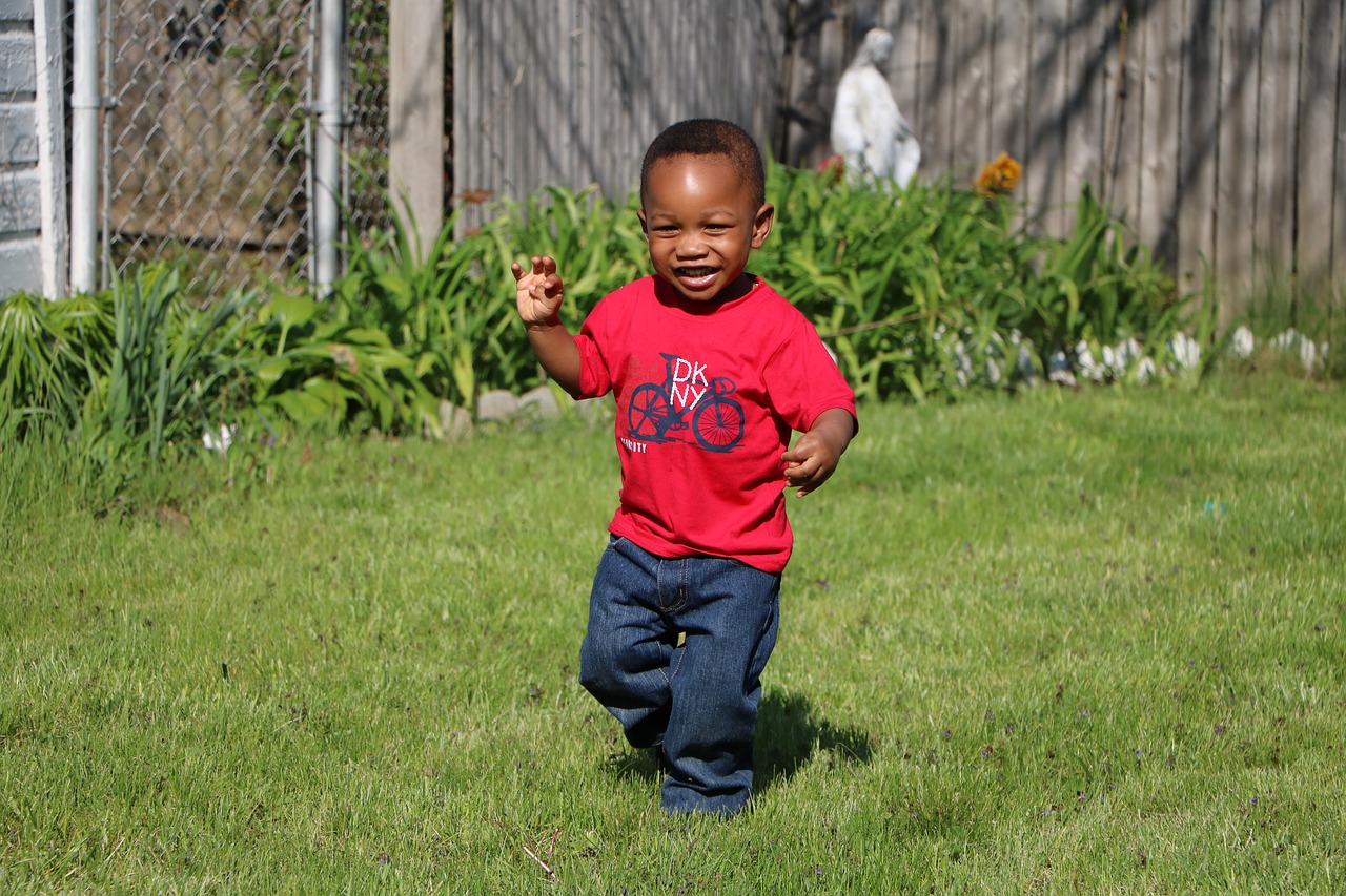 young boy playing playing running free photo