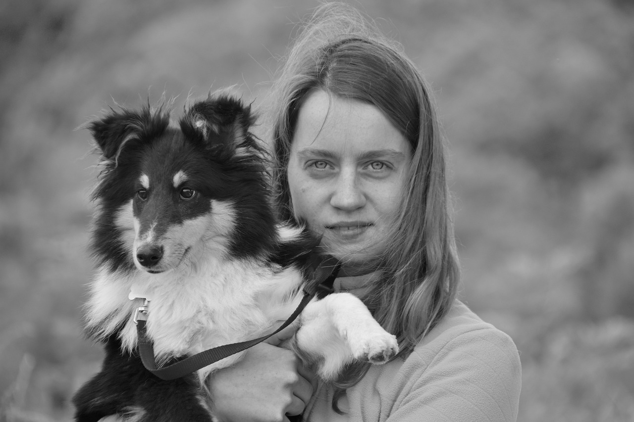 young girl and her dog  black and white photo  young woman free photo