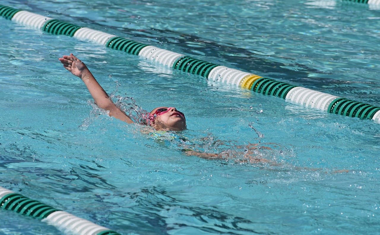 young swimmer backstroke swimming free photo