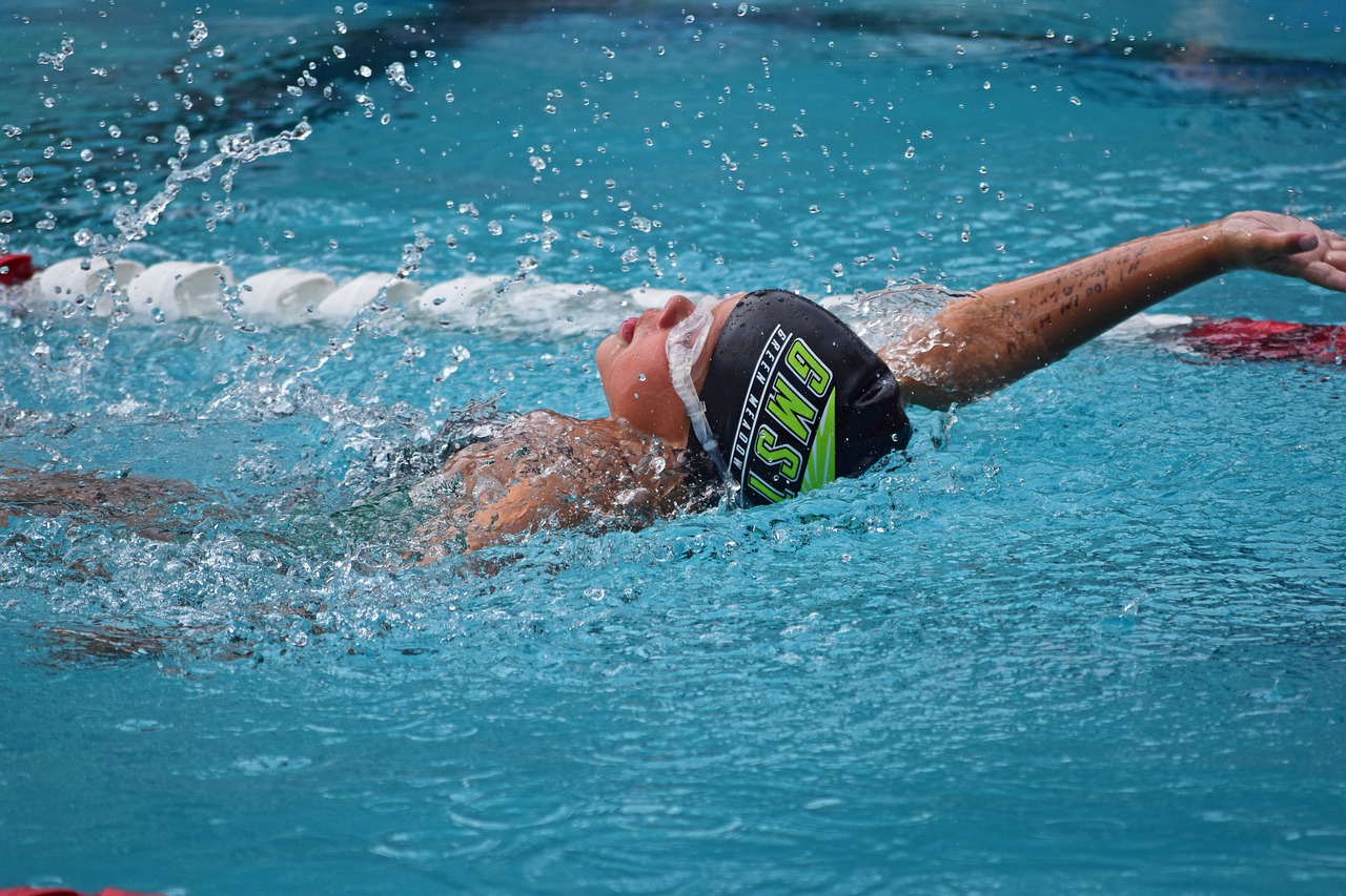 young swimmer backstroke swim meet free photo
