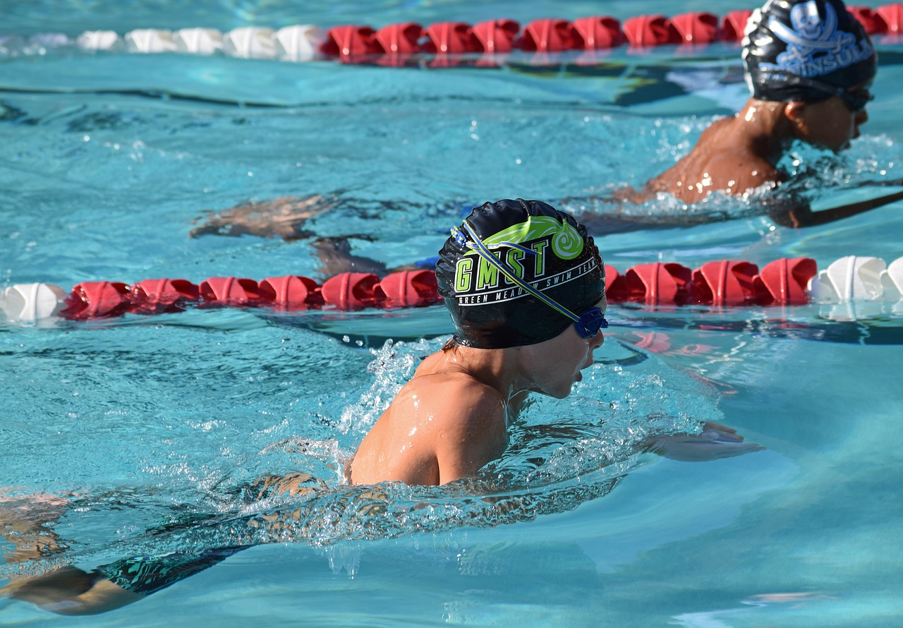 young swimmer breaststroke swim meet free photo