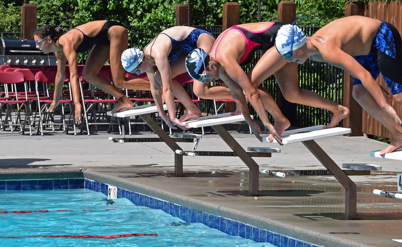 young swimmers beginning race swim meet free photo