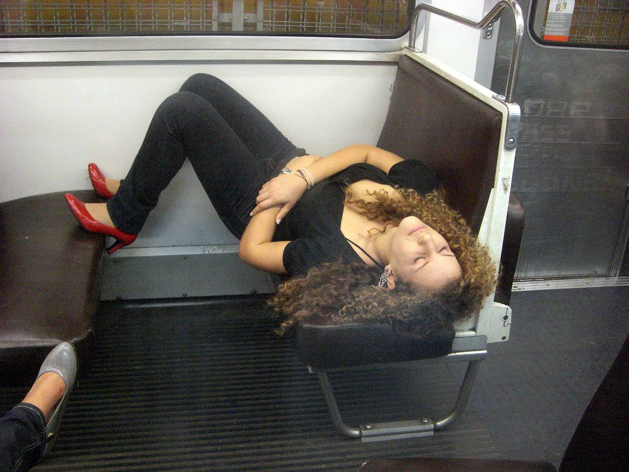 young woman sleeping on the subway pretty free photo