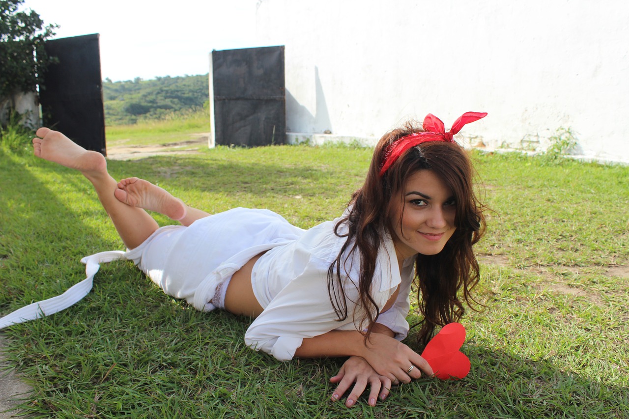 young woman grass lying free photo