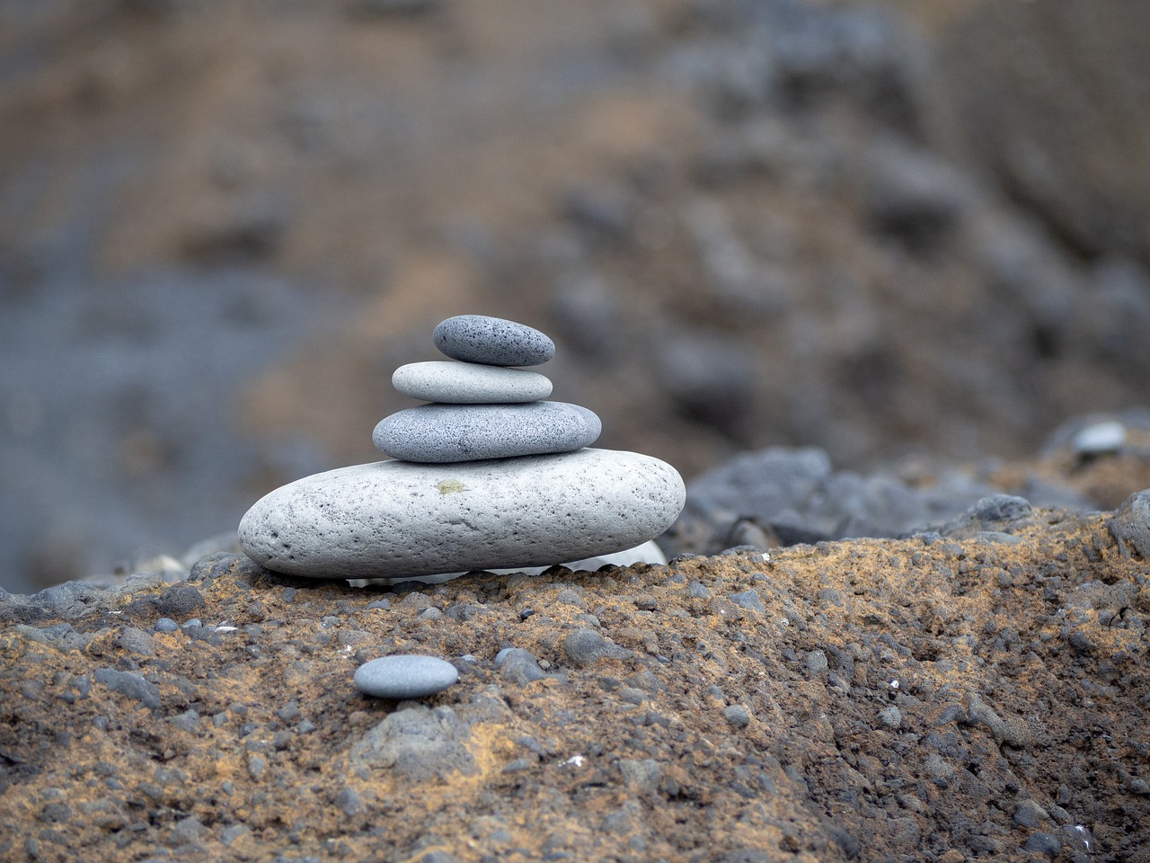 zen stack of stones  pile of stones  stones on a rock free photo