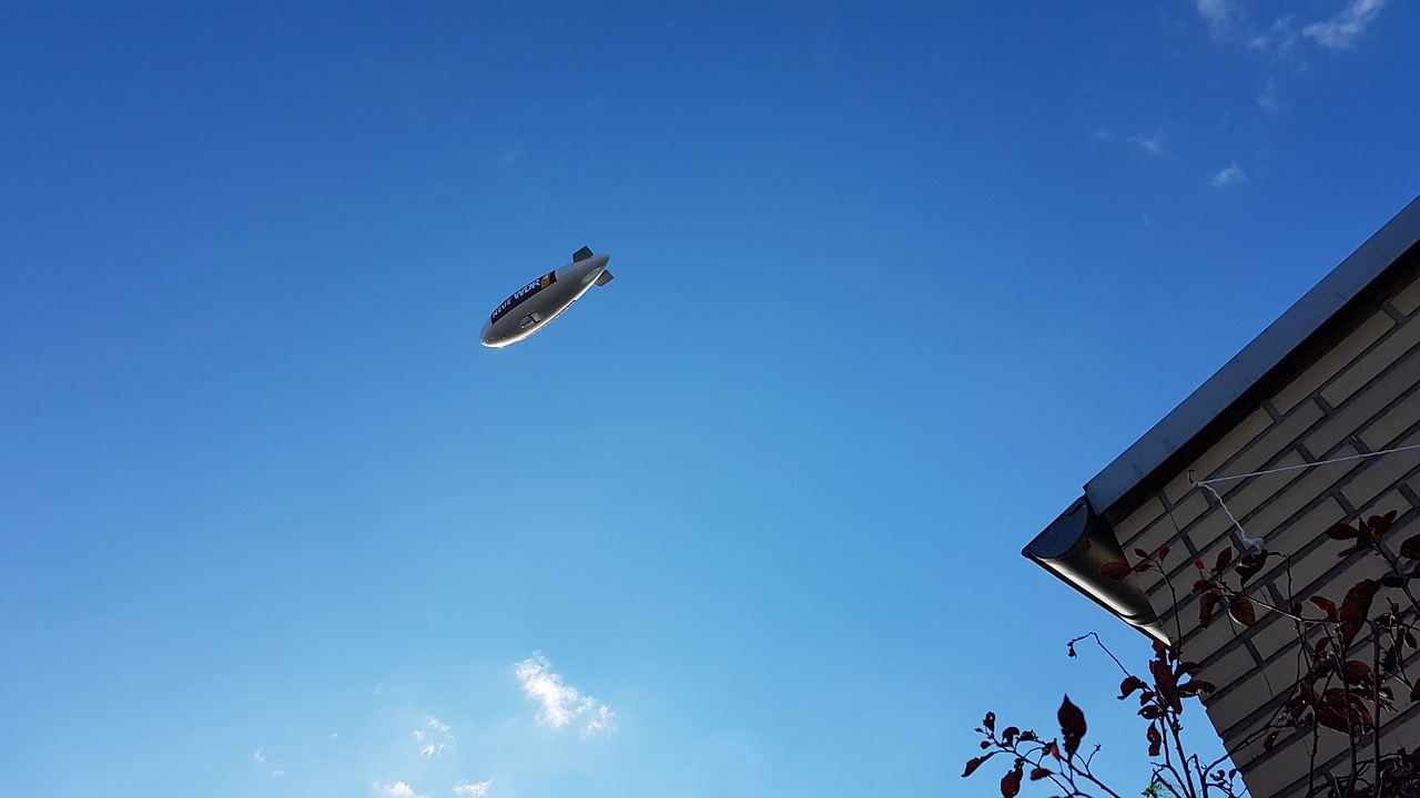 zeppelin blue sky time out free photo