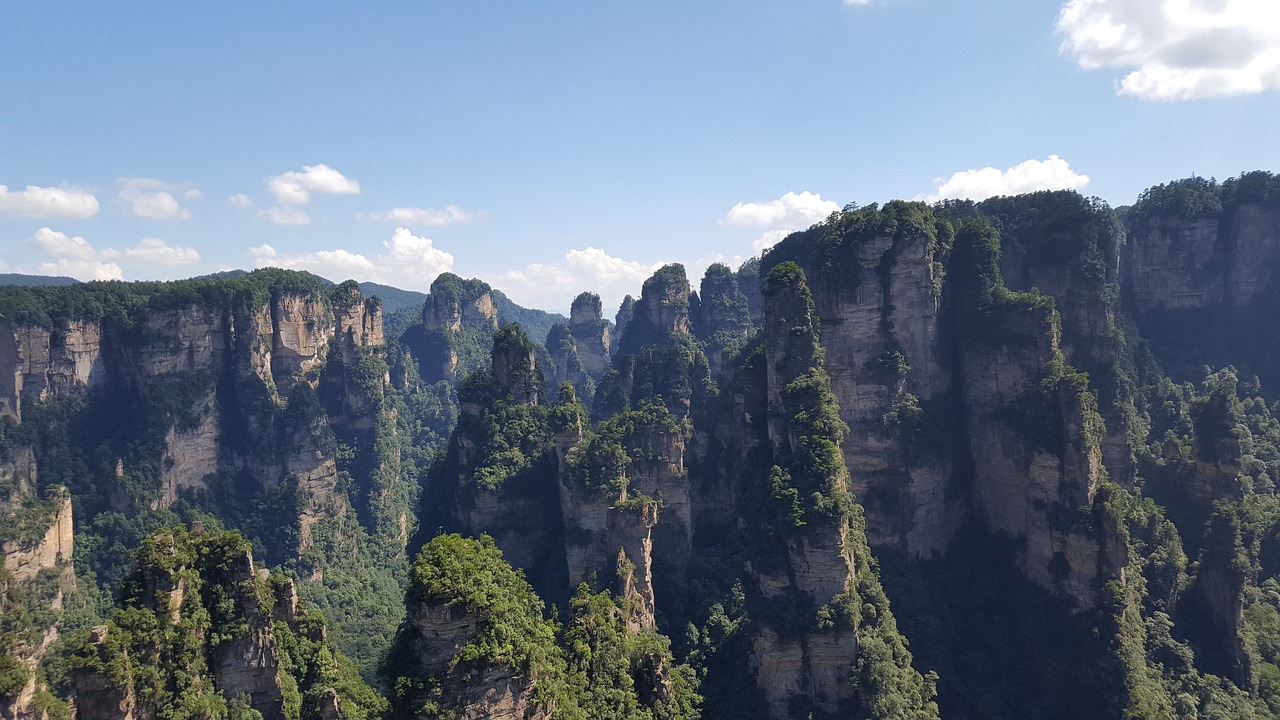 zhangjiajie blue sky and white clouds stone forest free photo