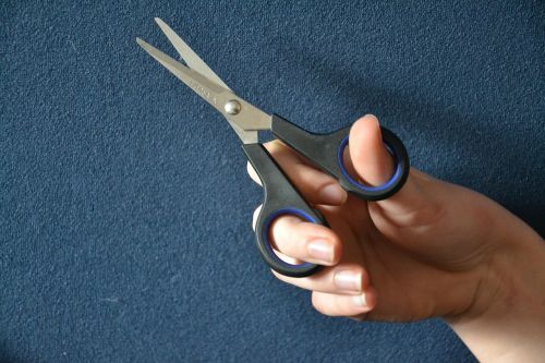 a pair of scissors scissors thread