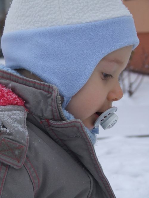 a small child winter a cap