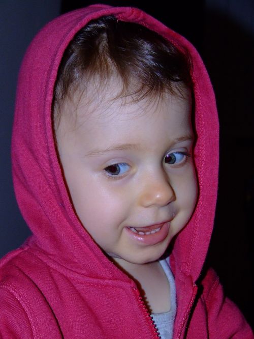 a small child pink jacket