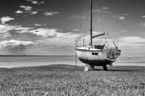 abandoned boat b w