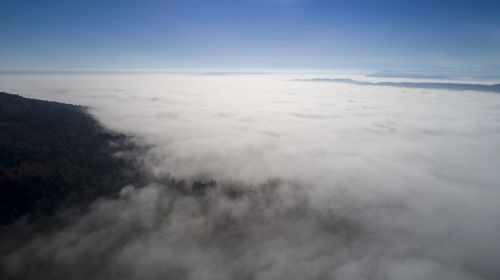 above the clouds fog clouds
