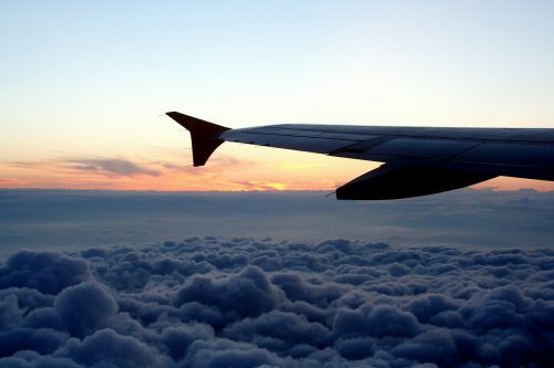 aircraft aircraft wing clouds