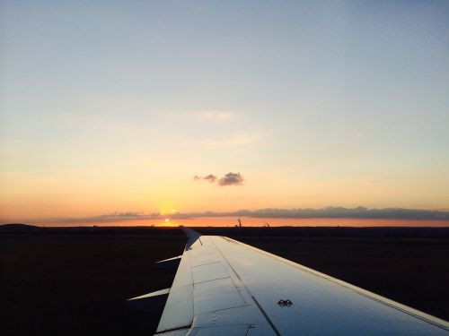 aircraft wing wing sunset