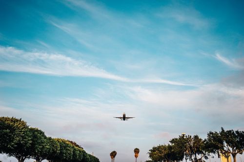 airplane takeoff blue