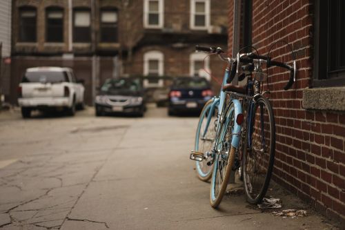 alley bicycles brick wall