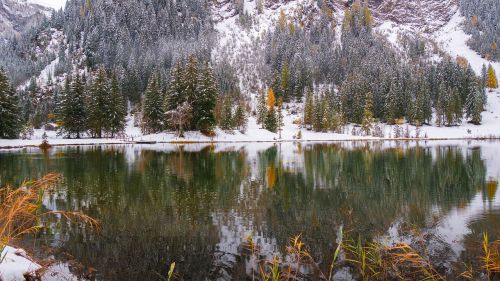 alpine lake snow mirroring