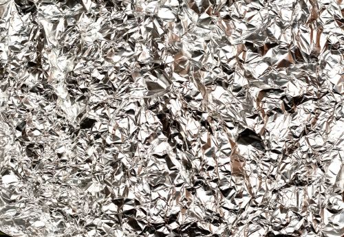 Red Aluminum Foil Is Crumpled Stock Photo, Picture and Royalty Free Image.  Image 50756446.