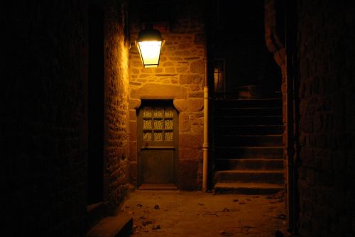 ancient door street light mont st michel