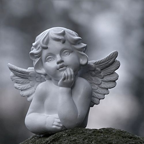 angel sitting figure