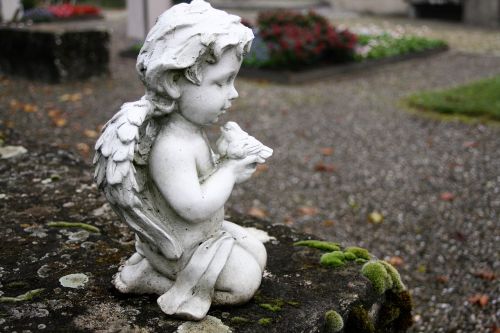 angel sculpture moss